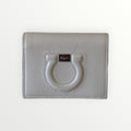 FERRAGAMO GANCIO CITY PEBBLED LEATHER COMPACT WALLET